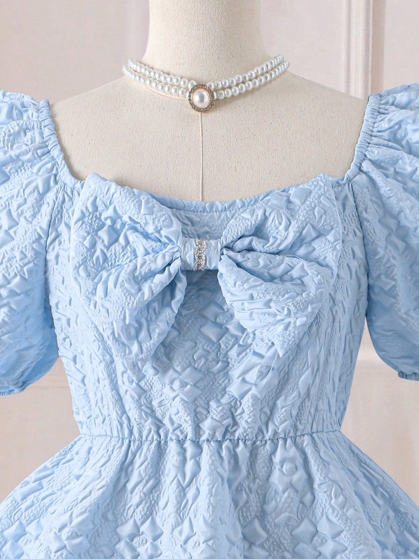 Vestido Celeste Texturizado Con Lazo Para Niña