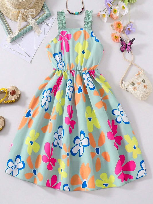 Imagen frontal: Vestido verde floral con tirantes para niña visto de frente.