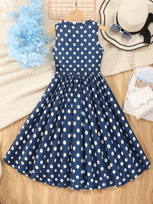Vista trasera del vestido midi azul con lunares para niñas, con cremallera y talle alto.