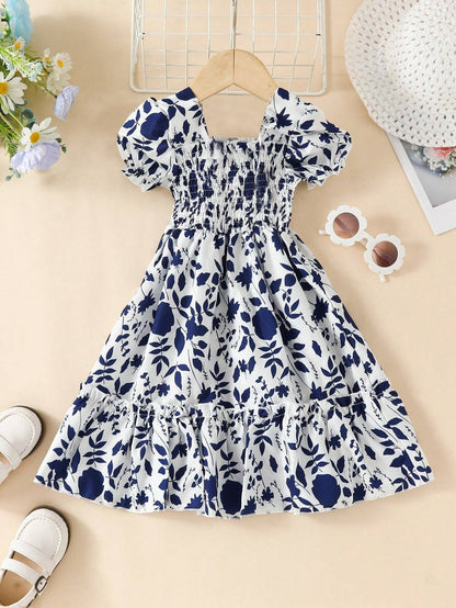 Vestido bohemio para niña azul marino, vista completa sobre fondo decorado