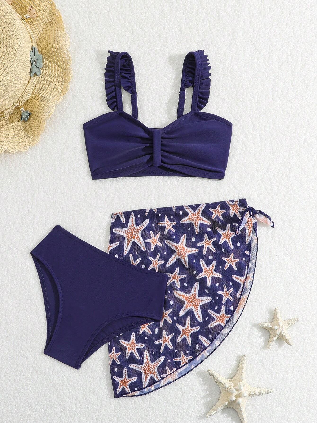 Conjunto de bikini azul marino con falda estampada de estrellas de mar.