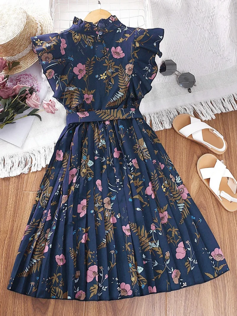 Parte trasera del vestido azul marino floral para niña con falda plisada.