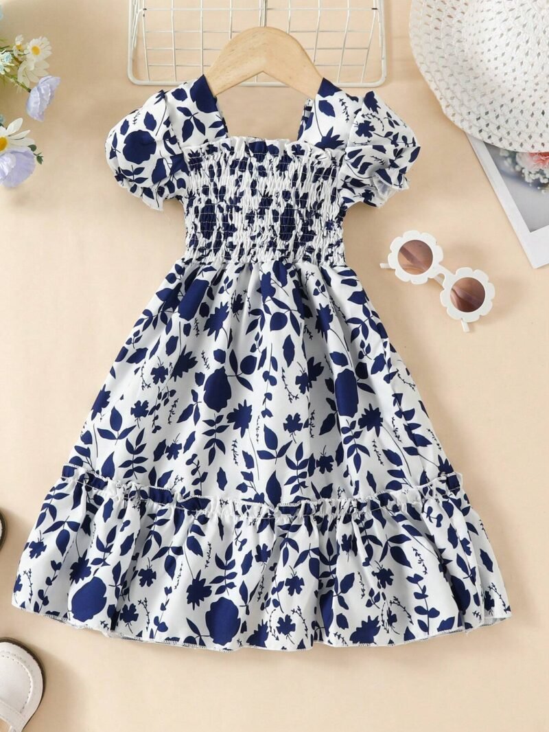 Vestido bohemio para niña azul marino con estampado floral en vista frontal