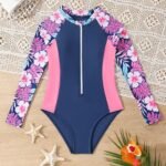 Traje de baño de manga larga para niñas con estampado floral y cremallera frontal.
