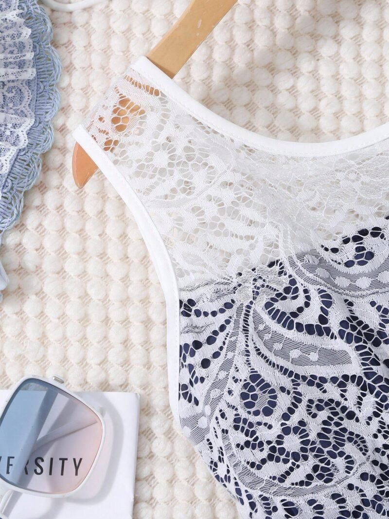 Vestido elegante azul marino para niña con encaje y falda de tul, ideal para ocasiones especiales.