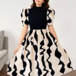 Vestido midi elegante para niñas con cuello alzado y manga farol, ideal para eventos especiales.