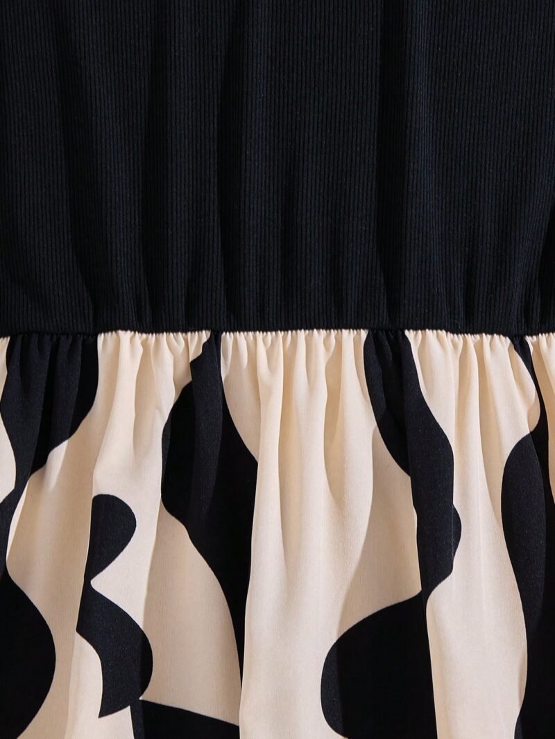 Detalle del vestido midi elegante para niñas, resaltando la costura y el acabado de la falda.